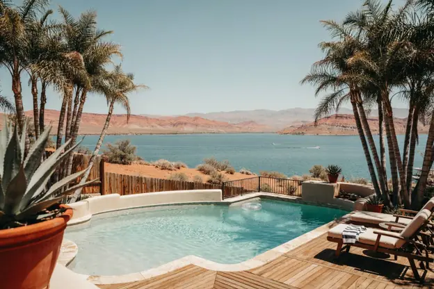 Pool on a bluff overlooking Lake Havasu and red desert hills