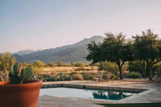 Pool in a Sierra Vista backyard with high-desert grassland and the Huachuca Mountains